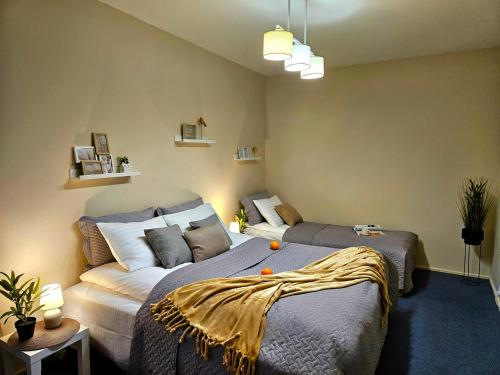a bedroom with two beds and a couch at Old Town Cathedral Views - Steps from Dome Square -Friends & Family stay in Riga