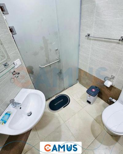 a bathroom with a sink and a shower and a toilet at CAMUS 343, Princess Resort in Hurghada
