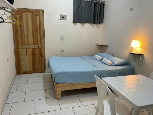 Llit o llits en una habitació de Miami Studios DR