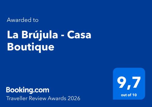 a blue rectangle with the words la brinyula casas boulevard at La Brújula - Casa Boutique in La Cumbre