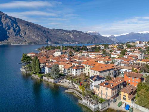 an aerial view of a town on the water at Foresteria Monastero B&B in Mandello del Lario