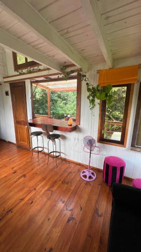 a room with chairs and a table in a house at La Tiny in Tigre