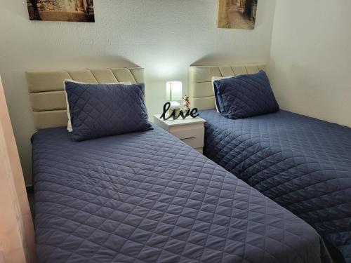 Llit o llits en una habitació de Casa Luna