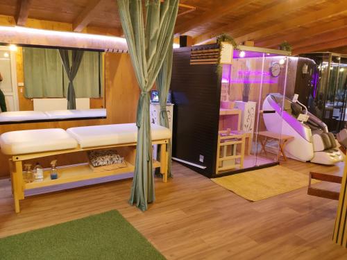 a room with a bed and a couch and a table at Odmaraliste Kod Miće Apartman 4 in Krušar