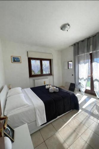 a bedroom with a large bed in a room at Il Giardino di Luna in Poggio Nativo
