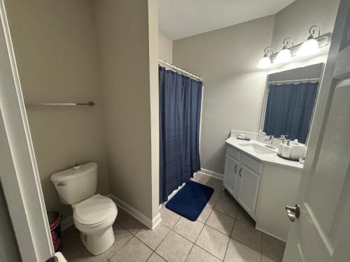 a bathroom with a toilet and a sink at The Burnham in Oxford
