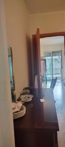 a dining room with a table with plates on it at Colonne Blu in Ginosa Marina