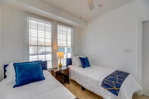 a bedroom with two beds and a window at 3 Mi to Beach: Ocean View Getaway w/ Pool Access in Ocean View