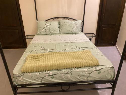 Villa Amani tesisinde bir odada yatak veya yataklar
