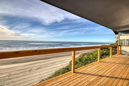 a deck with a view of the ocean at Boone Family Retreat in Lincoln Beach