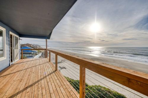 a balcony of a house with a view of the beach at Boone Family Retreat in Lincoln Beach