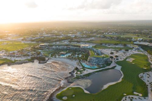 an aerial view of the golf course at the oceanfront resort at The St. Regis Cap Cana Resort in Punta Cana