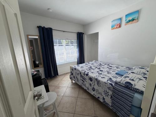 a small bedroom with a bed and a window at B5 Best Value on Private Bedroom with Private Bathroom in Little Havana, Miami in Miami