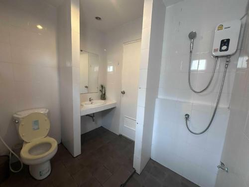 a bathroom with a toilet and a sink at M&M Kata Beach in Kata Beach