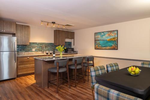 a kitchen with a kitchen island with a counter top at La Tourelle Inn & Spa in Ithaca