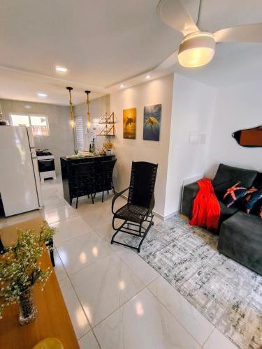 a living room with a couch and a table at Apartamento Jacumã -Conde-PB in Conde