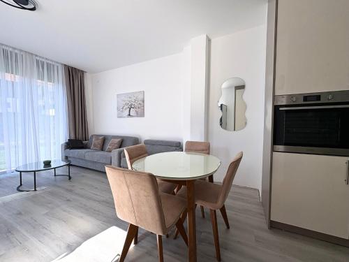 a living room with a table and a couch at Villa Maja in Trebinje