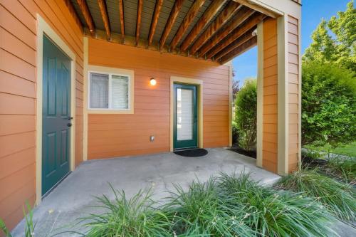 a front door of a house with a garage at Condo with Sauna & Fitness Center, Adjustable Base King Sized Bed in Coeur d'Alene