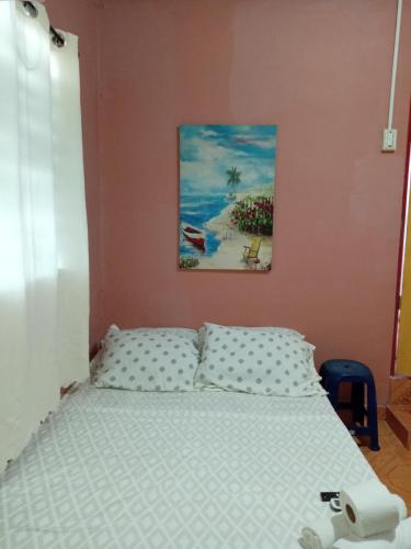 En eller flere senge i et værelse på Ofiuras Hostal