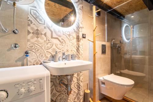 a bathroom with a sink and a toilet at Pink bird apartments and FREE PARKING in Virpazar