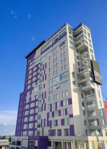 a tall building with many windows on top of it at La Quinta by Wyndham Puebla Palmas Angelopolis in Puebla