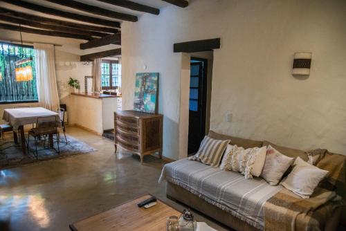 a living room with a couch and a table at Encantadora casa de campo in Ciudad Lujan de Cuyo