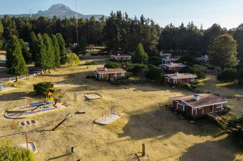 an aerial view of a park with a playground at Centro Vacacional Malintzi in Guadalupe