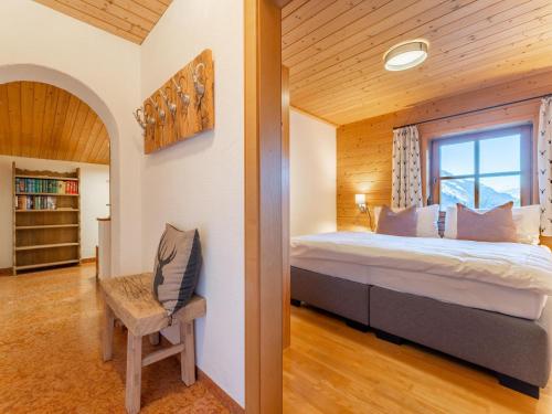 a bedroom with a bed and a window at Spykerhütte in Rauris