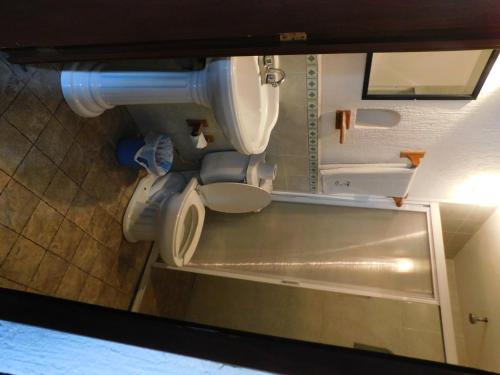 a bathroom with a sink and a toilet at Casa Brusodia in Guadalajara