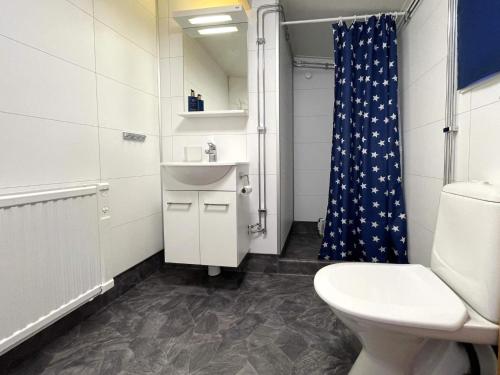 a bathroom with a toilet and a sink and a shower at 4 person holiday home in VALDERMARSVIK in Valdemarsvik