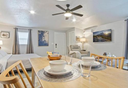 a dining room and living room with a table and chairs at Studio 8mins to Integris Monthly 15 Off #04 in Oklahoma City