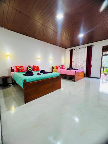 a bedroom with two beds in a room at Mount View Plaza - Ella Cottage with Mountain &Valley View in Ella