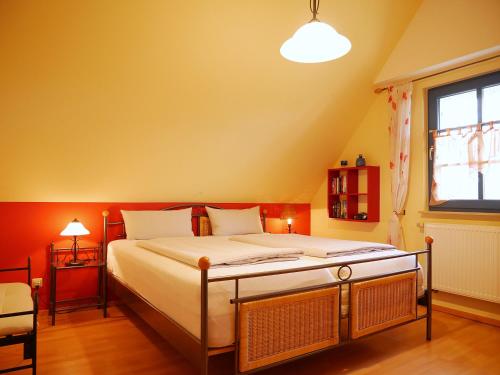 a bedroom with a large bed in a room at Mohnblume in Am Schwarzen Busch