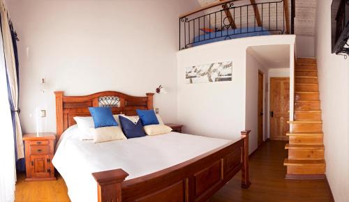 מיטה או מיטות בחדר ב-La Perla Hotel