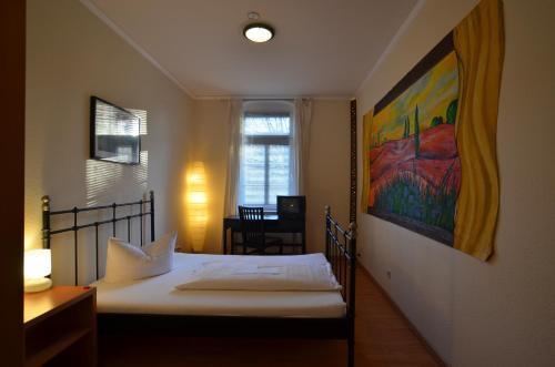 Postel nebo postele na pokoji v ubytování Gästehaus Villa Seraphinum