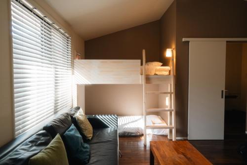 a living room with a bunk bed and a couch at Condominium MIRAHAKONE in Hakone