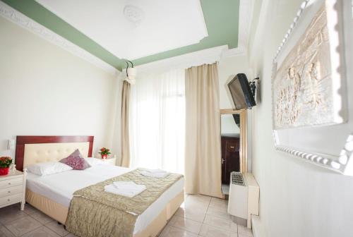 Postel nebo postele na pokoji v ubytování Hotel Zografos