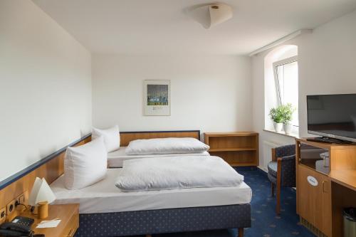 Postel nebo postele na pokoji v ubytování Landhotel Sonnenhof