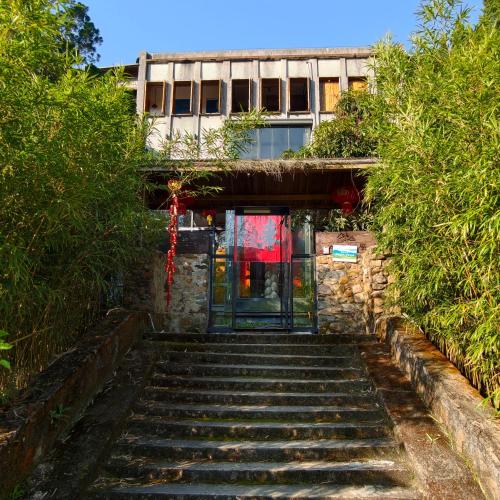 a set of stairs leading up to a building at Limu Mountain Forest Park in Hainan