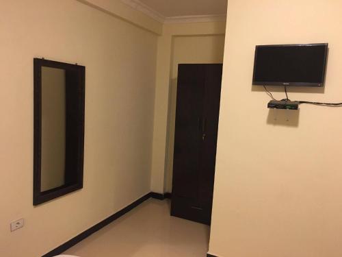 Televisyen dan/atau pusat hiburan di Cheers Bed & Breakfast