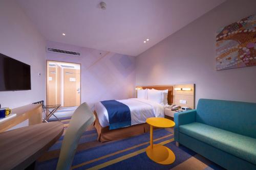 Postel nebo postele na pokoji v ubytování Holiday Inn Express Shanghai Zhenping by IHG