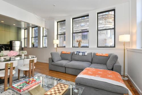 a living room with a couch and a table at Luxury 3 Bedroom Retreat in Downtown Manhattan in New York