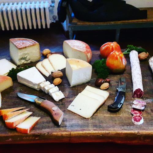 a bunch of different types of cheese on a table at Bella di Ceciliano in Arezzo