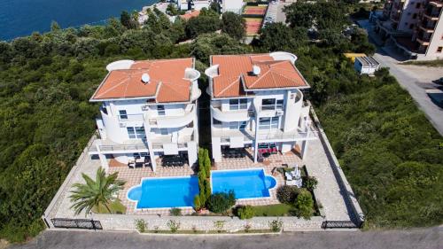 an aerial view of a house with a swimming pool at Royal Villas in Dobra Voda