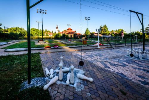 a statue of a person laying on a playground at Rezort u Bobiho in Nový Tekov