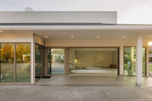 an open entry to a house with sliding glass doors at Balcomo, a Ramada by Wyndham in Penticton