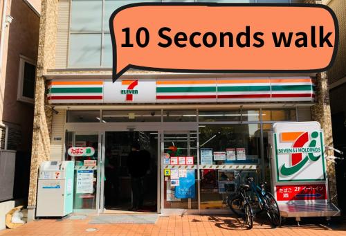 a store with a second walk sign in front at IZA Enoshima Guest House in Fujisawa