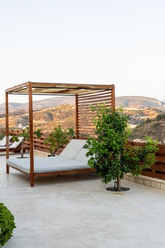 a bed sitting on top of a roof at Villa Flam in Kholi