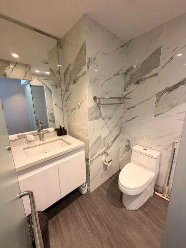 a bathroom with a toilet and a sink at Utopia Dream in Rawai Beach
