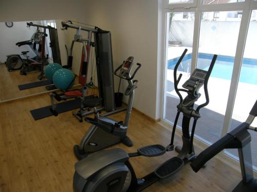 a gym with several exercise bikes in a room at Hotel Dom Nuno in Santiago do Cacém